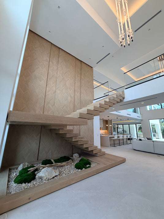 TF Stairs floating staircase showing hardwood treads, steel stringer, and glass railing.